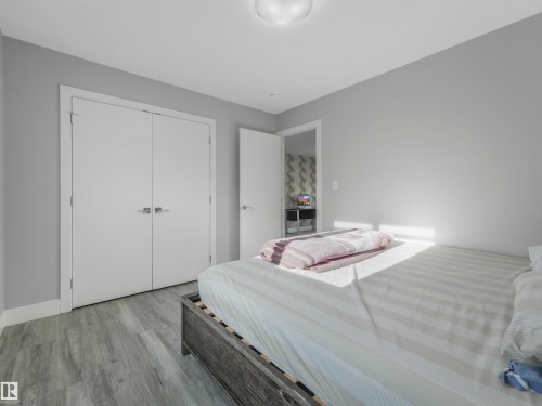 Bedroom featuring wood finished floors and a closet - 2412 14 Avenue, Edmonton, AB - Indoor Photo Showing Bedroom
