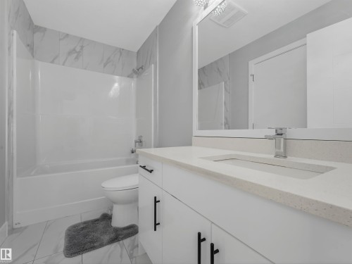 Bathroom with vanity and  shower combination - 2412 14 Avenue, Edmonton, AB - Indoor Photo Showing Bathroom