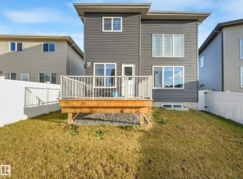 Rear view of property featuring a fenced backyard and a wooden deck - 2412 14 Avenue, Edmonton, AB - Outdoor With Deck Patio Veranda With Exterior