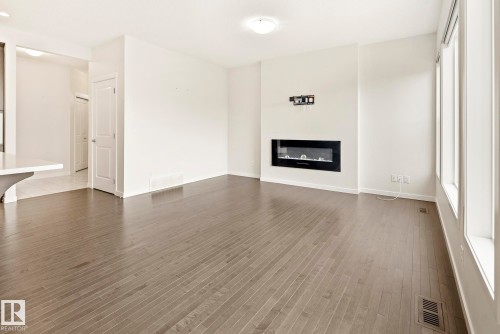 5404 22 Avenue, Edmonton, AB - Indoor Photo Showing Living Room With Fireplace