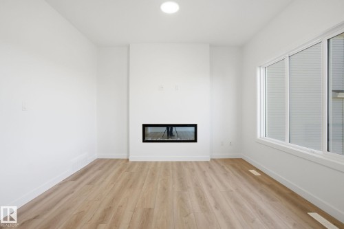 7104 47A Street, Beaumont, AB - Indoor With Fireplace