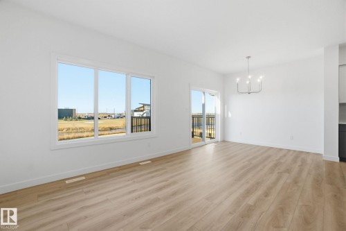7104 47A Street, Beaumont, AB - Indoor Photo Showing Other Room With Fireplace