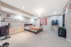 Bedroom with light carpet and recessed lighting - 