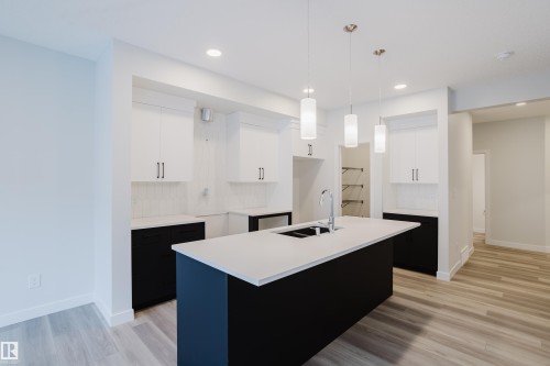 362 Bluff Cove, Leduc, AB - Indoor Photo Showing Kitchen With Double Sink