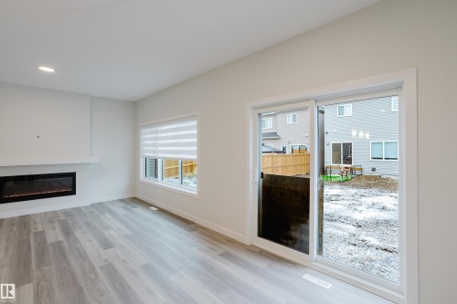 362 Bluff Cove, Leduc, AB - Indoor Photo Showing Living Room With Fireplace