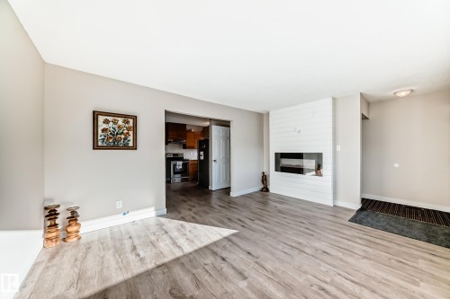3004 132A Avenue, Edmonton, AB - Indoor Photo Showing Other Room With Fireplace