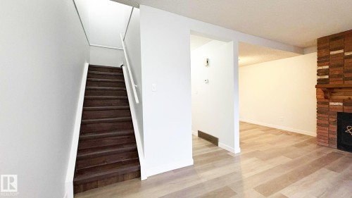 10427 24 Avenue, Edmonton, AB - Indoor Photo Showing Other Room With Fireplace