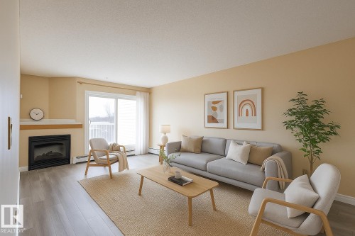 404 11446 40 Avenue, Edmonton, AB - Indoor Photo Showing Living Room With Fireplace