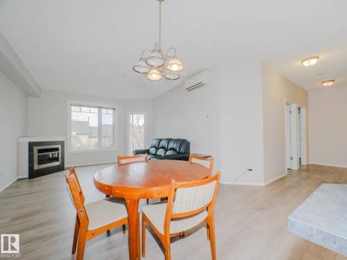209 12111 51 Avenue, Edmonton, AB - Indoor Photo Showing Other Room With Fireplace