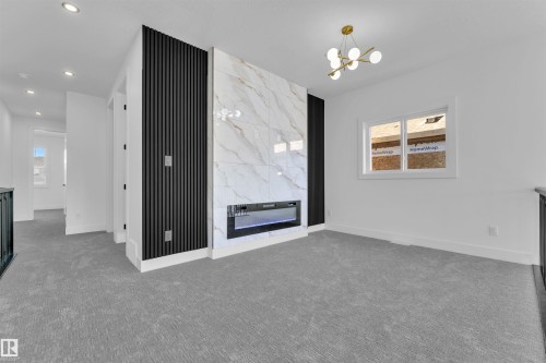 4008 40 Street, Beaumont, AB - Indoor Photo Showing Other Room With Fireplace