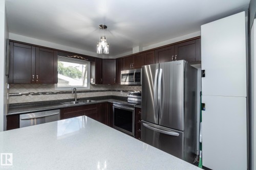 3418 120 Avenue, Edmonton, AB - Indoor Photo Showing Kitchen With Double Sink