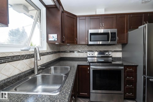 3418 120 Avenue, Edmonton, AB - Indoor Photo Showing Kitchen With Double Sink