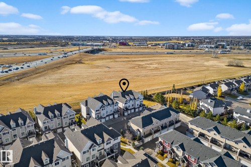 Aerial perspective of suburban area featuring a main thoroughfare - 117 7293 South Terwillegar Drive, Edmonton, AB - Outdoor With View
