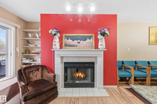 201 9010 106 Avenue, Edmonton, AB - Indoor Photo Showing Living Room With Fireplace