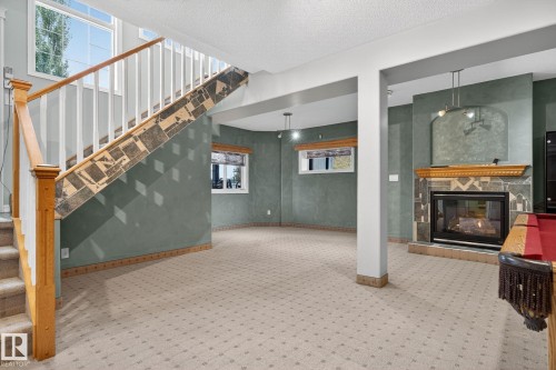 576 Glenwright Crescent, Edmonton, AB - Indoor Photo Showing Other Room With Fireplace