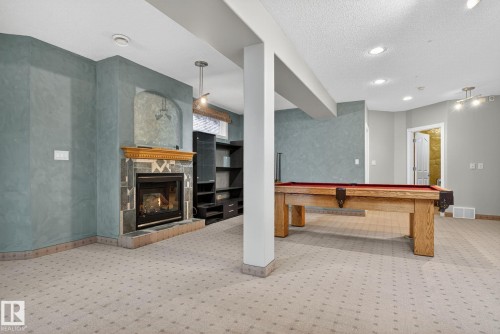 576 Glenwright Crescent, Edmonton, AB - Indoor Photo Showing Other Room With Fireplace