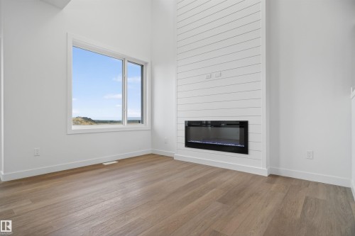 151 Pierwyck Loop, Spruce Grove, AB - Indoor Photo Showing Living Room With Fireplace