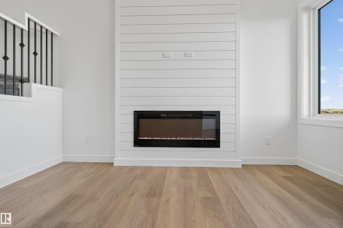 153 Pierwyck Loop, Spruce Grove, AB - Indoor Photo Showing Living Room With Fireplace
