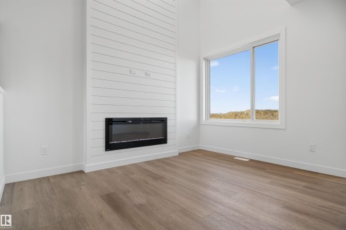 153 Pierwyck Loop, Spruce Grove, AB - Indoor Photo Showing Living Room With Fireplace