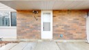 Doorway to property featuring brick siding - 114 2908 116A Avenue, Edmonton, AB  - Outdoor With Exterior 