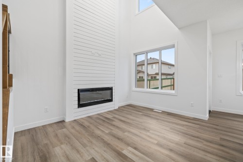 95 Ficus Way, Fort Saskatchewan, AB - Indoor Photo Showing Living Room With Fireplace