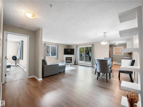 102 10511 42 Avenue, Edmonton, AB - Indoor Photo Showing Living Room With Fireplace