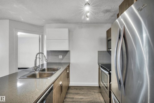 106 667 Watt Boulevard, Edmonton, AB - Indoor Photo Showing Kitchen With Stainless Steel Kitchen With Double Sink With Upgraded Kitchen