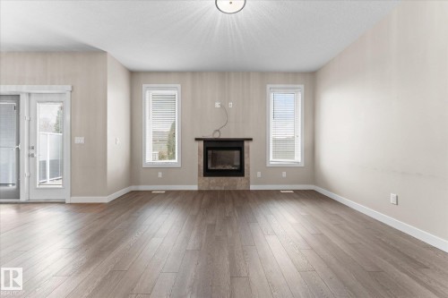 88 Brickyard Bend, Stony Plain, AB - Indoor Photo Showing Living Room With Fireplace