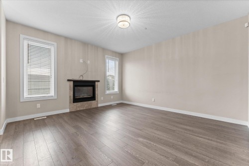 88 Brickyard Bend, Stony Plain, AB - Indoor Photo Showing Living Room With Fireplace