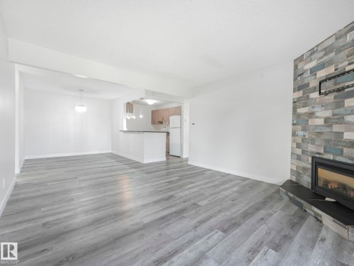303 10528 29 Avenue, Edmonton, AB - Indoor Photo Showing Living Room With Fireplace