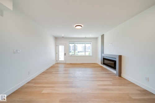 21 Starling Way, Fort Saskatchewan, AB - Indoor Photo Showing Other Room With Fireplace