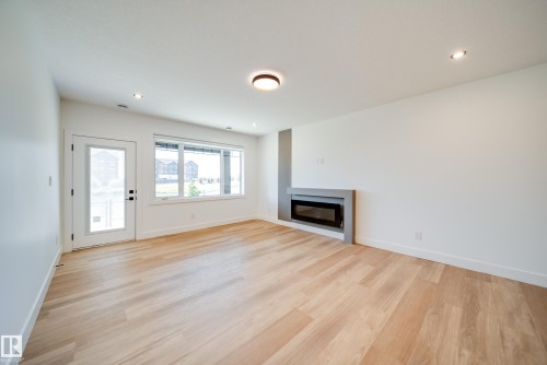 21 Starling Way, Fort Saskatchewan, AB - Indoor Photo Showing Other Room With Fireplace