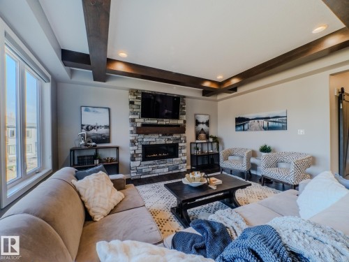 4710 41 Street, Beaumont, AB - Indoor Photo Showing Living Room With Fireplace