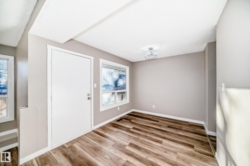 Entryway featuring light wood-type flooring and baseboards - 44 4403 Riverbend Road, Edmonton, AB - Indoor Photo Showing Other Room