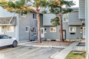Rear view of property featuring uncovered parking - 44 4403 Riverbend Road, Edmonton, AB  - Outdoor 
