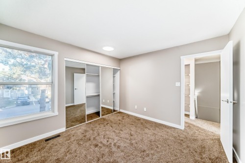 Unfurnished bedroom featuring carpet floors and a closet - 44 4403 Riverbend Road, Edmonton, AB - Indoor Photo Showing Other Room