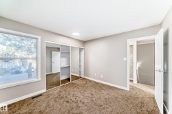 Unfurnished bedroom featuring carpet floors and a closet - 