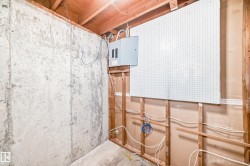 Utility room featuring electric panel - 