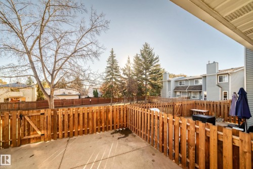 Fenced backyard featuring a residential view and a patio - 44 4403 Riverbend Road, Edmonton, AB - Outdoor