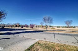 View of asphalt road with street lighting - 