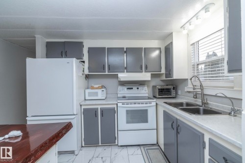 1011 West Mount Crescent, Edmonton, AB - Indoor Photo Showing Kitchen With Double Sink