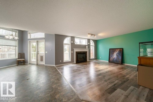 6 Lansing, Spruce Grove, AB - Indoor Photo Showing Living Room With Fireplace