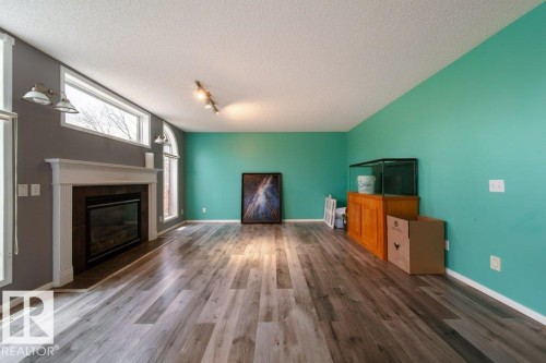 6 Lansing, Spruce Grove, AB - Indoor Photo Showing Other Room With Fireplace