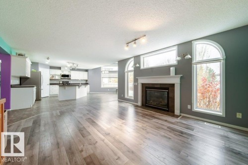 6 Lansing, Spruce Grove, AB - Indoor Photo Showing Living Room With Fireplace