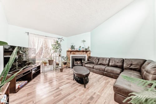 14159 26 Street, Edmonton, AB - Indoor Photo Showing Living Room With Fireplace