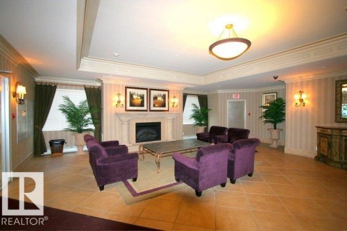 1402 9707 105 Street Nw, Edmonton, AB - Indoor Photo Showing Living Room With Fireplace