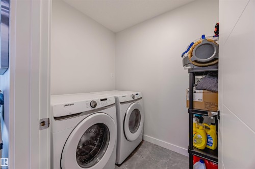 Laundry room featuring baseboards and separate washer and dryer - 8086 Kiriak Link, Edmonton, AB - Indoor Photo Showing Laundry Room