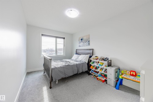 Bedroom with baseboards - 8086 Kiriak Link, Edmonton, AB - Indoor Photo Showing Bedroom