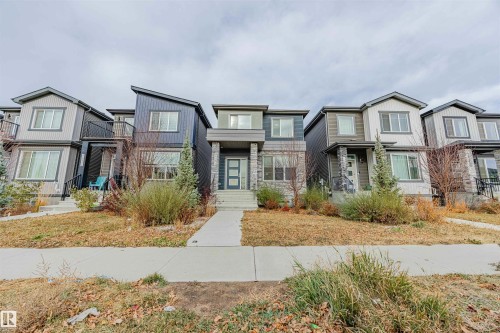 View of front facade with a residential view - 8086 Kiriak Link, Edmonton, AB - Outdoor With Facade