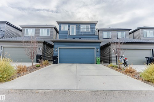 Traditional-style house featuring concrete driveway and a garage - 8086 Kiriak Link, Edmonton, AB - Outdoor With Facade